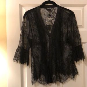 Sheer black floral lace Bebe top NWT size M